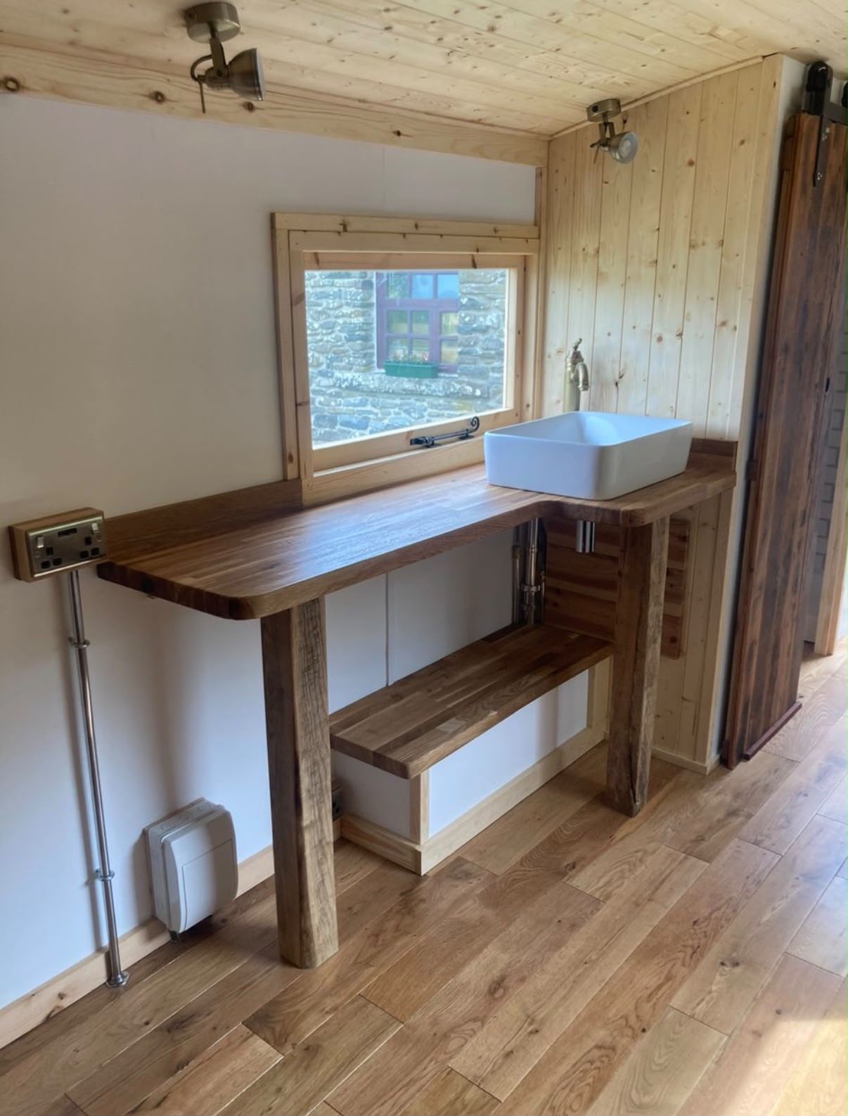 Handmade oak worktop and basin on reclaimed oak legs, with an oak floor.